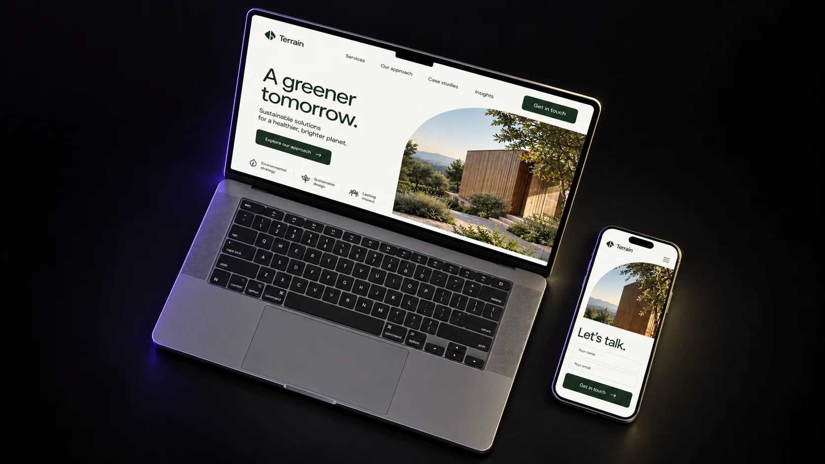 Terrain concept on a laptop and phone, overhead view.
